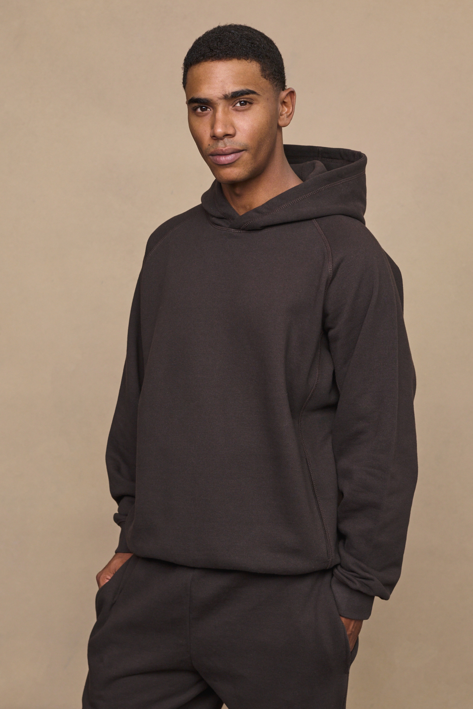 Men’s heavyweight cotton blend hoodie in dark brown with raglan sleeves by Raith