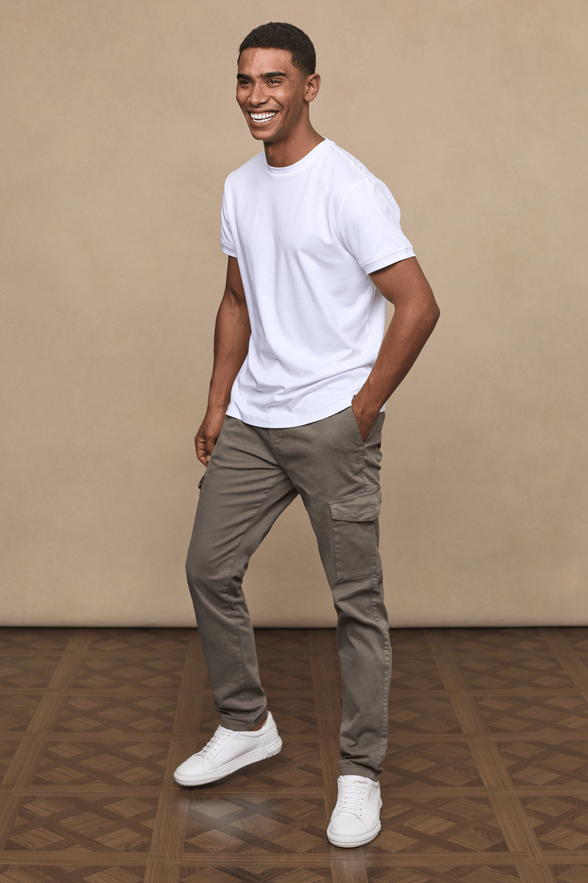 Men’s cotton stretch cargo trousers in dark olive with straight leg fit and utility pockets by Raith