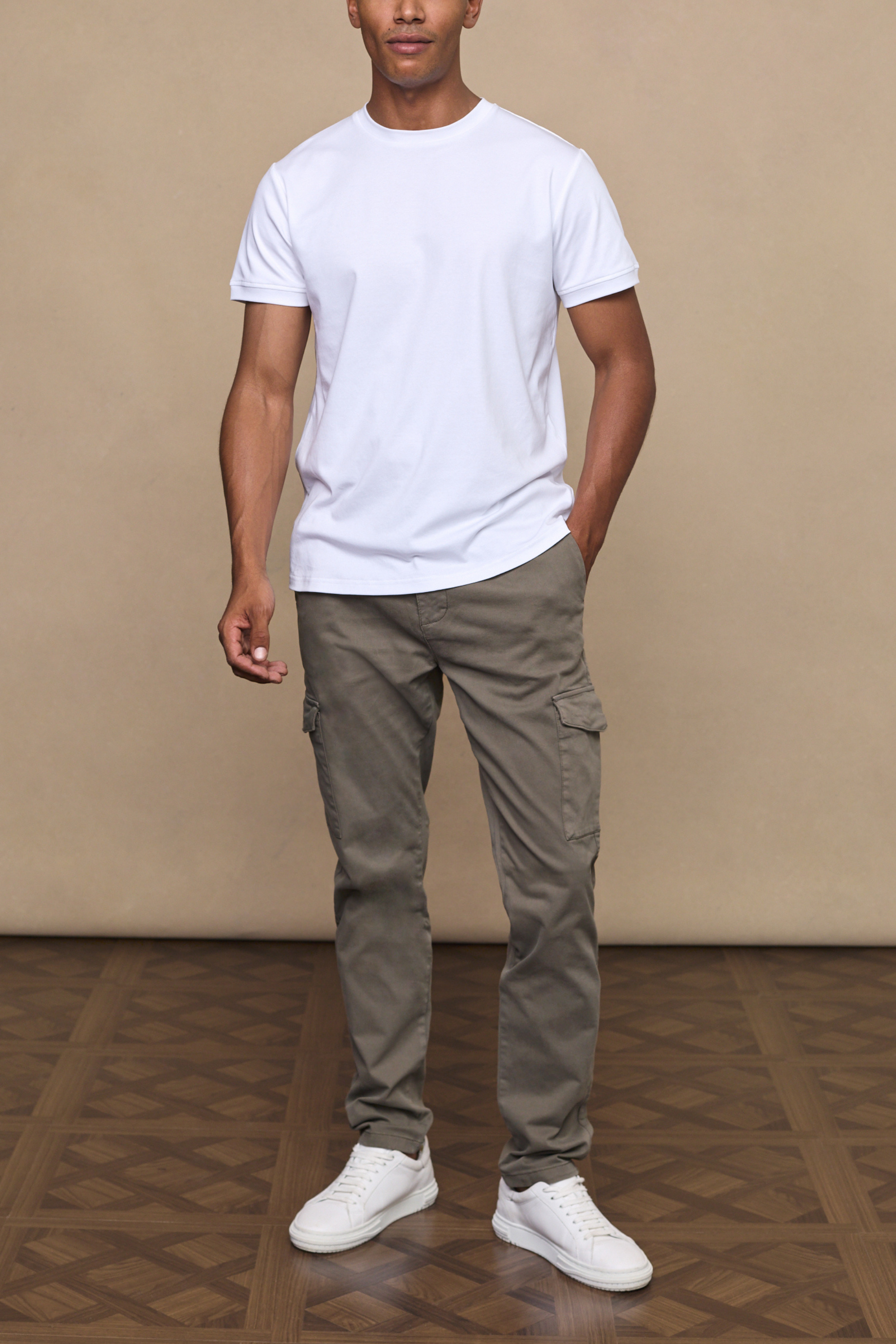 Men’s cotton stretch cargo trousers in dark olive with straight leg fit and utility pockets by Raith