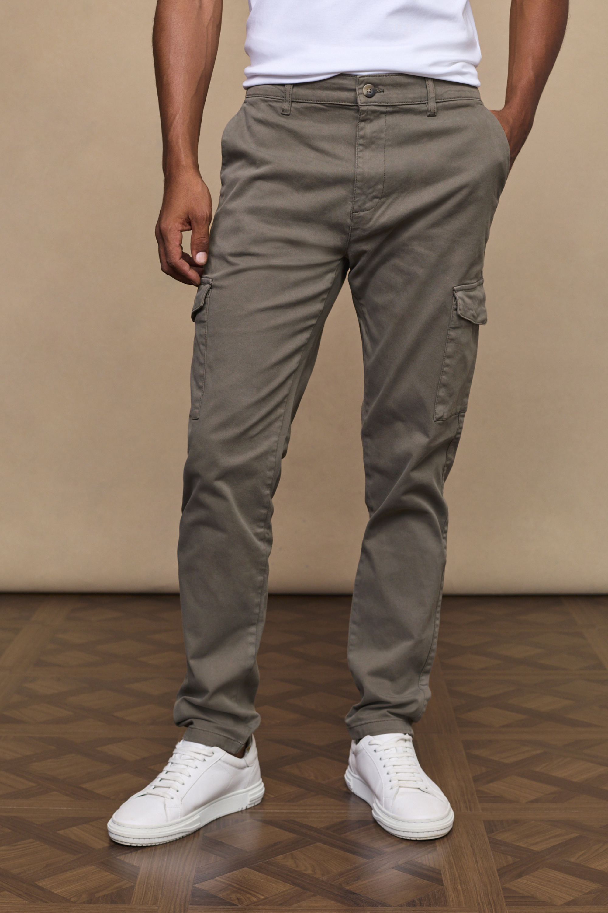 Men’s cotton stretch cargo trousers in dark olive with straight leg fit and utility pockets by Raith