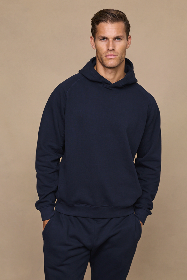 Men’s heavyweight cotton blend hoodie in navy with raglan sleeves by Raith