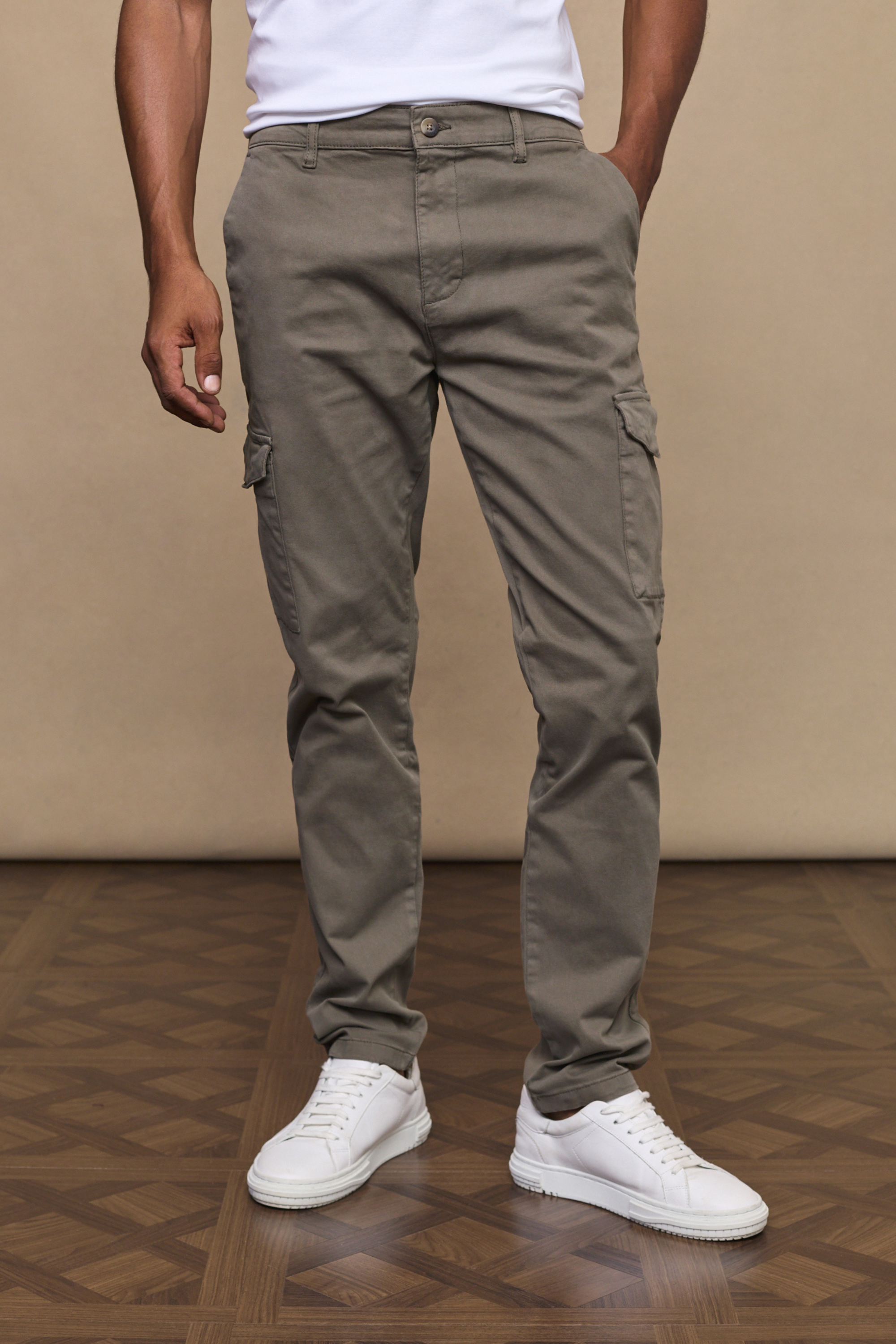 Men’s cotton stretch cargo trousers in dark olive with straight leg fit and utility pockets by Raith