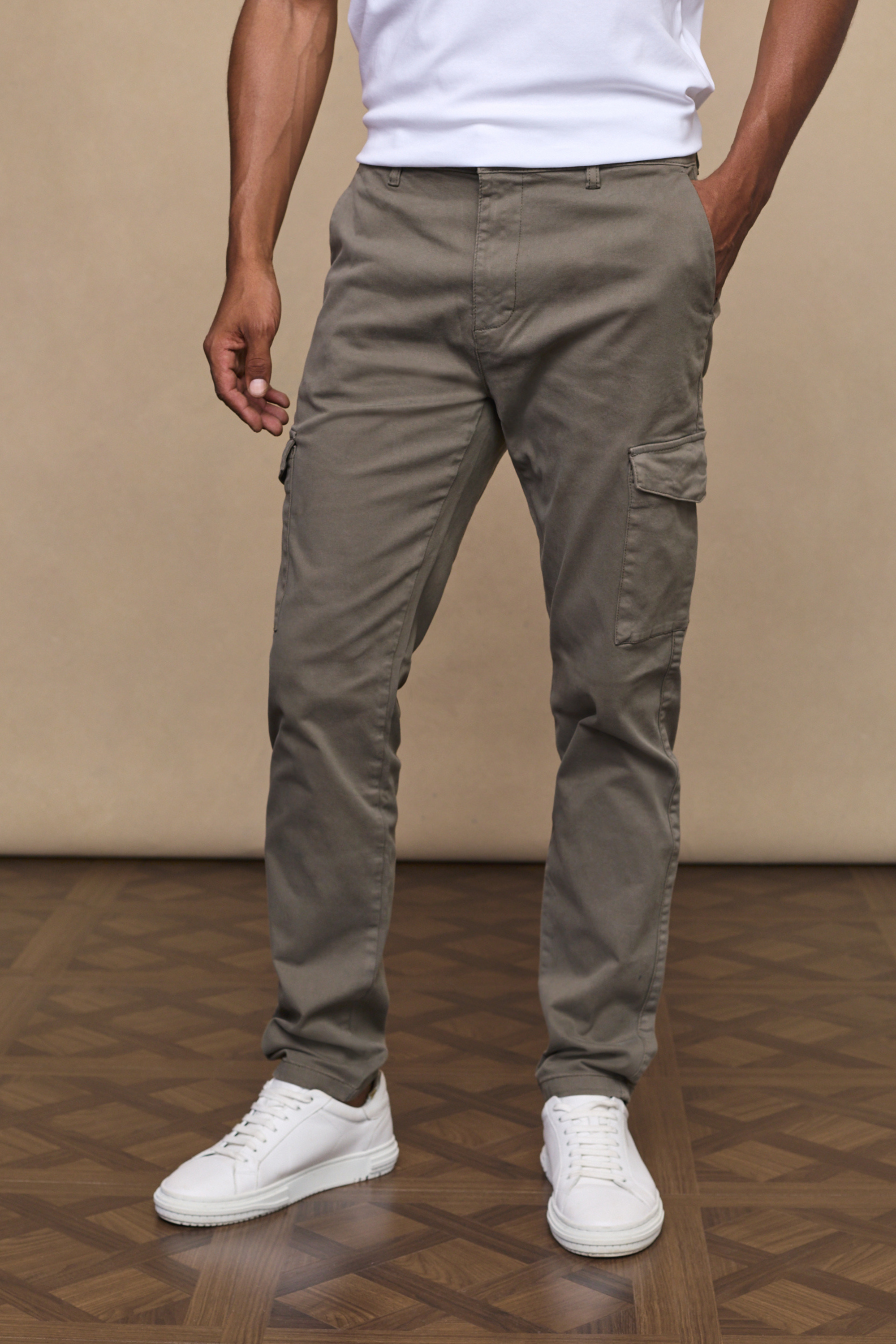 Men’s cotton stretch cargo trousers in dark olive with straight leg fit and utility pockets by Raith
